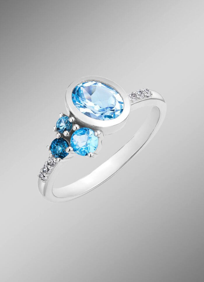 Damenring mit Blautopas (beh.), und synth. Zirkonia 