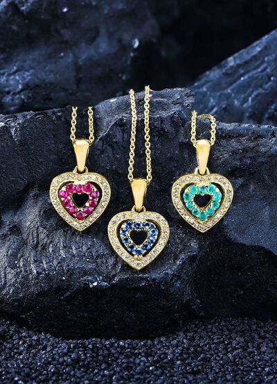 Anh&auml;nger mit synth. Zirkonia und roten Schmucksteinen 