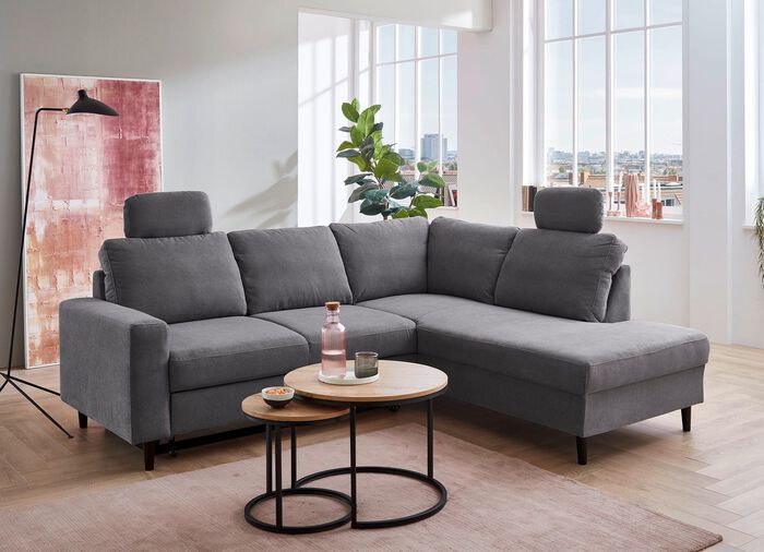 Polsterecke mit Bettfunktion und Ottomane 