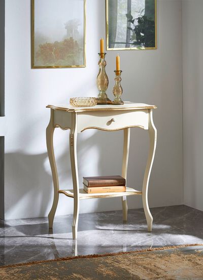 Telefontisch mit goldfarbenen Applikationen 